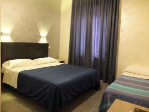 Postel nebo postele na pokoji v ubytování Guest Planet