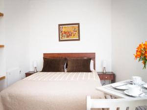 Una cama o camas en una habitación de Apart Hotel Tronador
