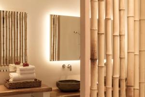 a bathroom with a sink and a mirror at Luxury Naxos Villas Premium Suite Air Conditioning Outdoor Pool 1 Bedroom Stelida in Naxos Chora