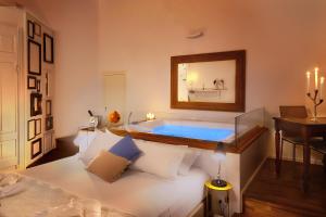 A bed or beds in a room at Naca Suite