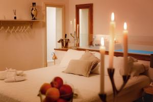 A bed or beds in a room at Naca Suite