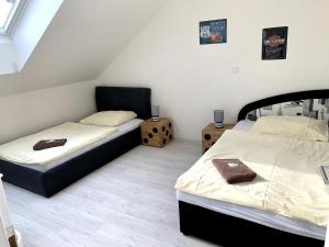 Postelja oz. postelje v sobi nastanitve Hotel Stará Pošta
