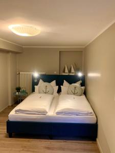 Postel nebo postele na pokoji v ubytování Haus am See