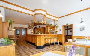 a kitchen with a island in the middle of a room at Zum Lindenbaum in Finnentrop