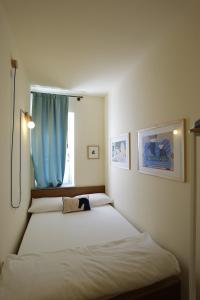 Postel nebo postele na pokoji v ubytování B&B Ai Tre Cavalli