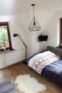Posteľ alebo postele v izbe v ubytovaní Apartament Antolka