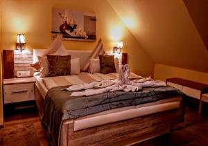 a bedroom with a large bed in a room at Moselina Gästezimmer in Sankt Aldegund