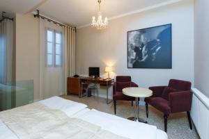 En eller flere senge i et værelse på Hotel Aplaus
