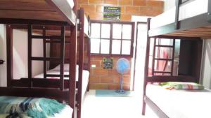 Postel nebo postele na pokoji v ubytování Esperanto Bed & Breakfast Surf Hostel