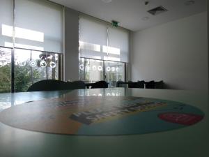 a conference room with a table and chairs and windows at HI Melgaco - Pousada de Juventude in Melgaço +60 photos