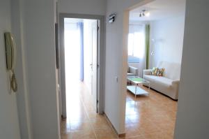 A bed or beds in a room at Apartamentos Sarah