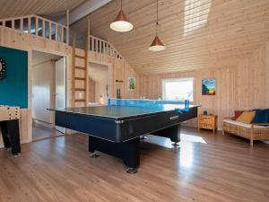 a large room with a pool table in it at 12 person holiday home in Idestrup in Marielyst