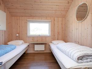 Postel nebo postele na pokoji v ubytování 12 person holiday home in Idestrup-By Traum