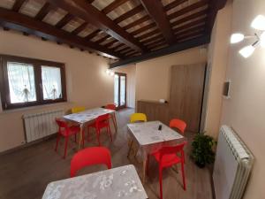 a room with tables and chairs in a building at Oasi Il Tiro a Segno in Norcia