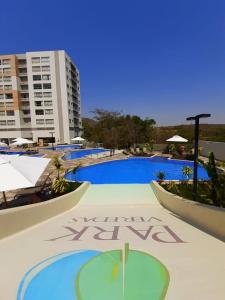 a large swimming pool with a resort sign on it at PARK VEREDAS FLAT 322 in Rio Quente