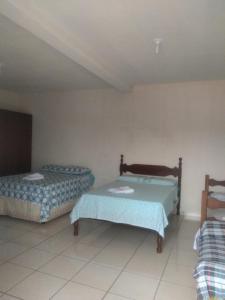 Posteľ alebo postele v izbe v ubytovaní Suítes Ponta do Sol (Trator)