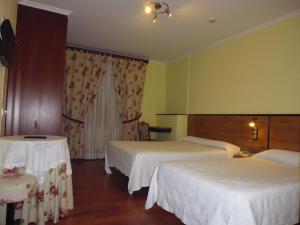 A bed or beds in a room at Cruceiro do Monte
