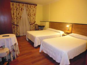 A bed or beds in a room at Cruceiro do Monte