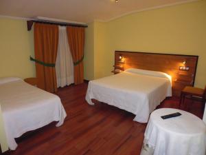 A bed or beds in a room at Cruceiro do Monte
