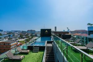 a swimming pool on the roof of a building at Acqua Hotel in Pattaya Central