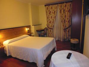 A bed or beds in a room at Cruceiro do Monte