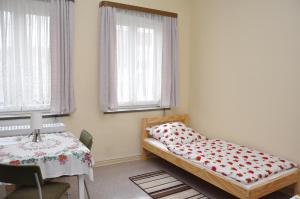 Ein Bett oder Betten in einem Zimmer der Unterkunft Hostel Herberge Werratal