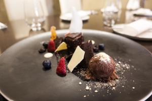 a plate of chocolate desserts on a table at Hotel U Kříže in Prague
