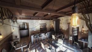 a restaurant with tables and chairs in a room at Hotel U Kříže in Prague