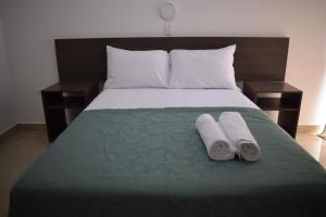 En eller flere senger på et rom på Mare S&M Casa Hostal