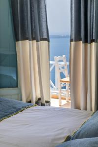 Llit o llits en una habitació de Blue Dolphins Apartments