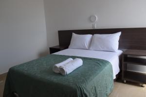 En eller flere senger på et rom på Mare S&M Casa Hostal