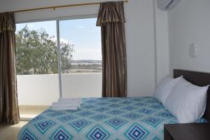 En eller flere senger på et rom på Mare S&M Casa Hostal
