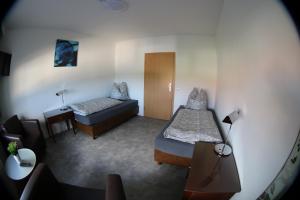 Postel nebo postele na pokoji v ubytování Gästehaus Kleinfurra