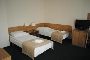 Letto o letti in una camera di Hotel Olimpijski