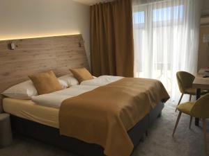 Voodi või voodid majutusasutuse Primma Hotel toas