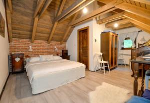 Postel nebo postele na pokoji v ubytování Vila Countryhouse Pijevci