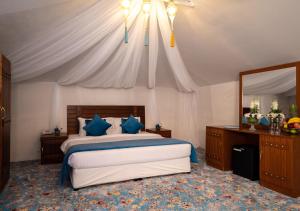 Voodi või voodid majutusasutuse Regency Sealine Camp toas