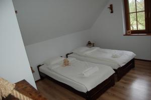 Postel nebo postele na pokoji v ubytování Cisna Chata - Bieszczady