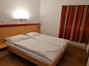 Postel nebo postele na pokoji v ubytování Hotel du Stand