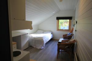 Giường trong phòng chung tại Skahjem Gard