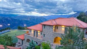 a house with a view of the mountains at Aegli Arachova in Arachova