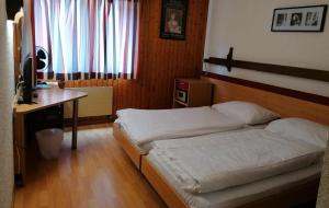 Postel nebo postele na pokoji v ubytování Hotel du Stand