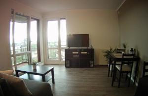 Un televizor și/sau centru de divertisment la Studio Belle Vue