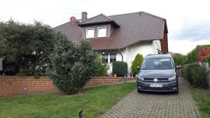 a van parked in front of a house at Villa Karin in Breitungen