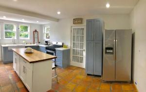 a kitchen with a stainless steel refrigerator and counters at Cozy Aqua Private Suite with Parking in Miami