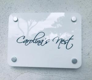 a sign that says anything is not on a wall at Carolina’S Nest in Casal Palocco