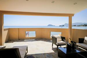 a living room with a view of the ocean at Sea Shell Beach Suite in Laganas