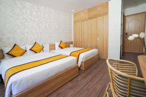 Postel nebo postele na pokoji v ubytování Sline Hotel