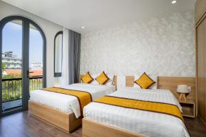 Postel nebo postele na pokoji v ubytování Sline Hotel + 16 fotografií