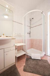 a bathroom with a shower and a sink at Apartment and Rooms Santini in Sveti Filip i Jakov +54 photos